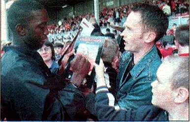 Dwight Yorke signs autographs for Wrexham fans